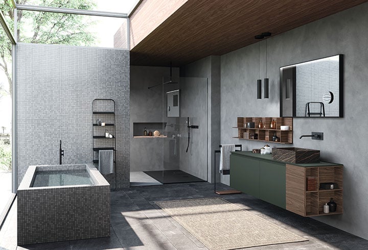 A natural light-filled bathroom with gray walls and a green Fenix countertop