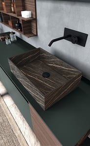 Closeup of a green Fenix countertop with a stone-look basin