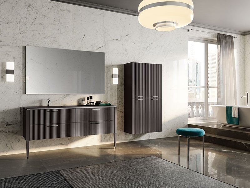 Lamé vanity with drawers, countertop, and wall-mounted storage cabinets