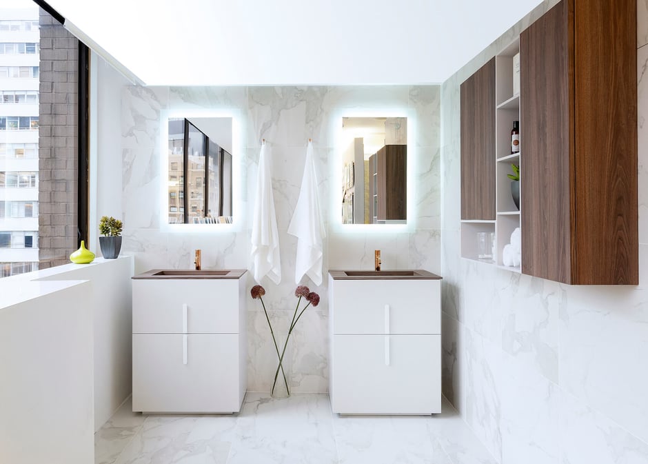 Two white vanities with wood countertops