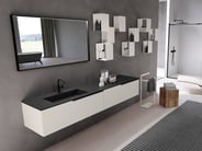Urban vanity with black countertop and white cabinets