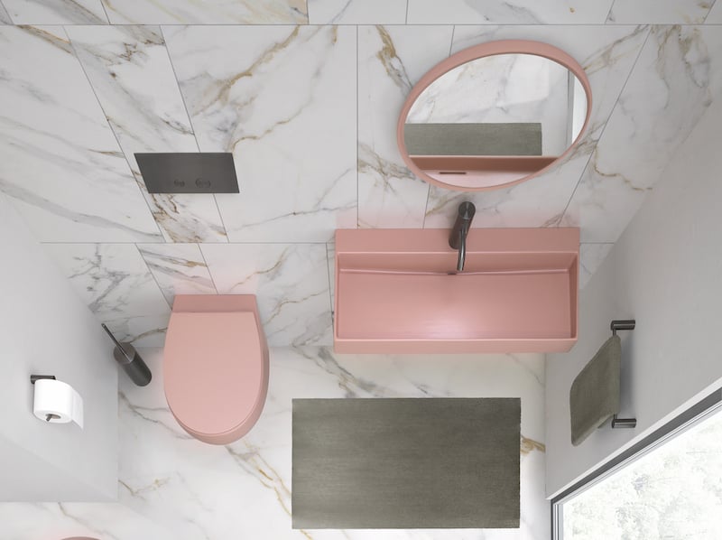 pink bathroom mirror, sink, and toilet
