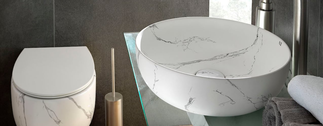Marble-look vessel sink and coordinating toliet