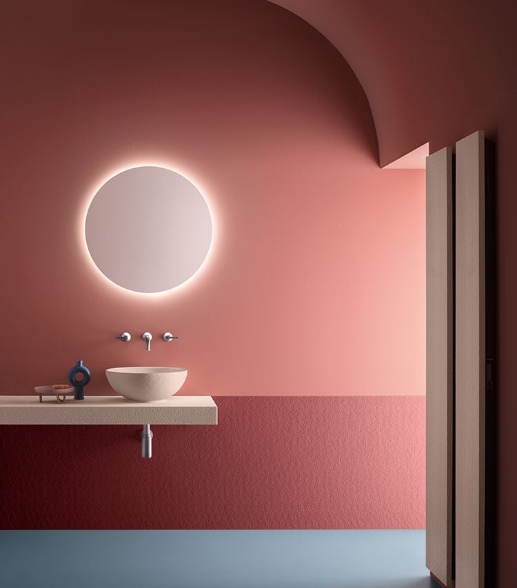 Pink textured vessel in colorful bathroom