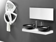 Double round black vessel sinks on white countertop