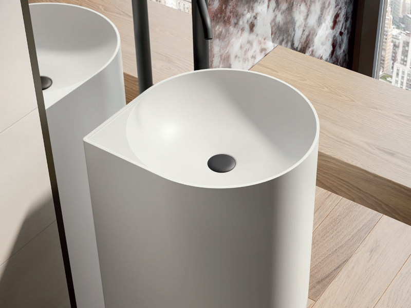 white teardrop-shaped pedestal sink