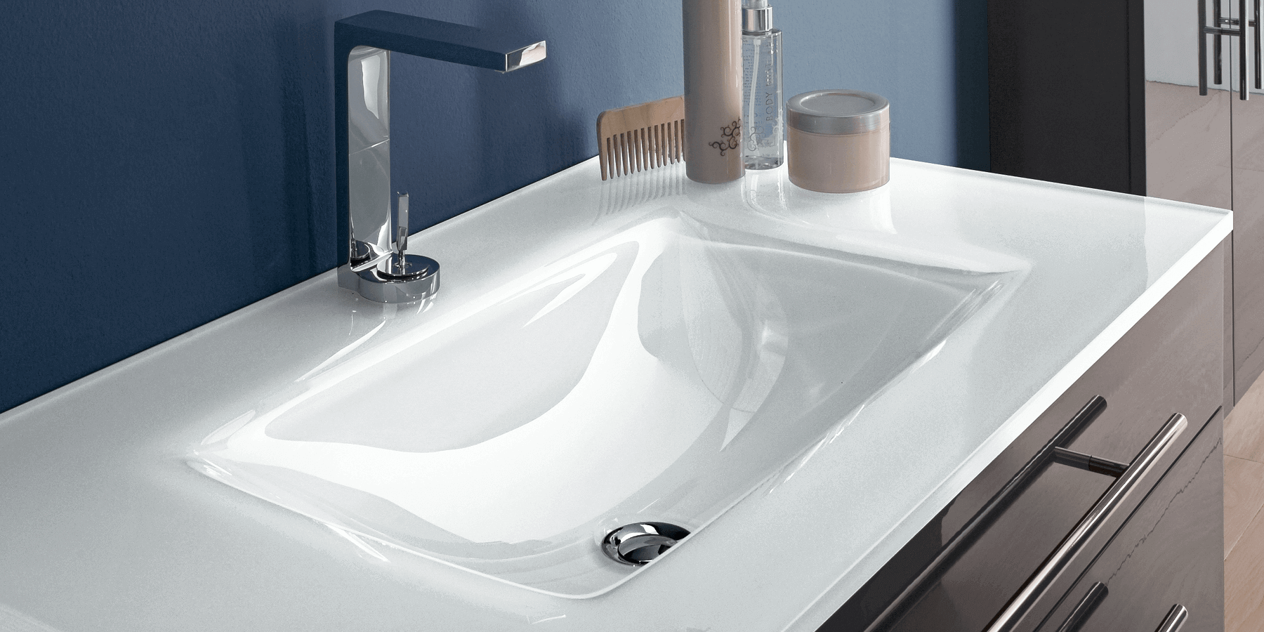 Luxury opaque white glass countertop with an integrated basin