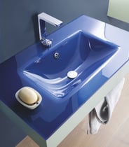 blue glass bathroom countertop with integrated basin