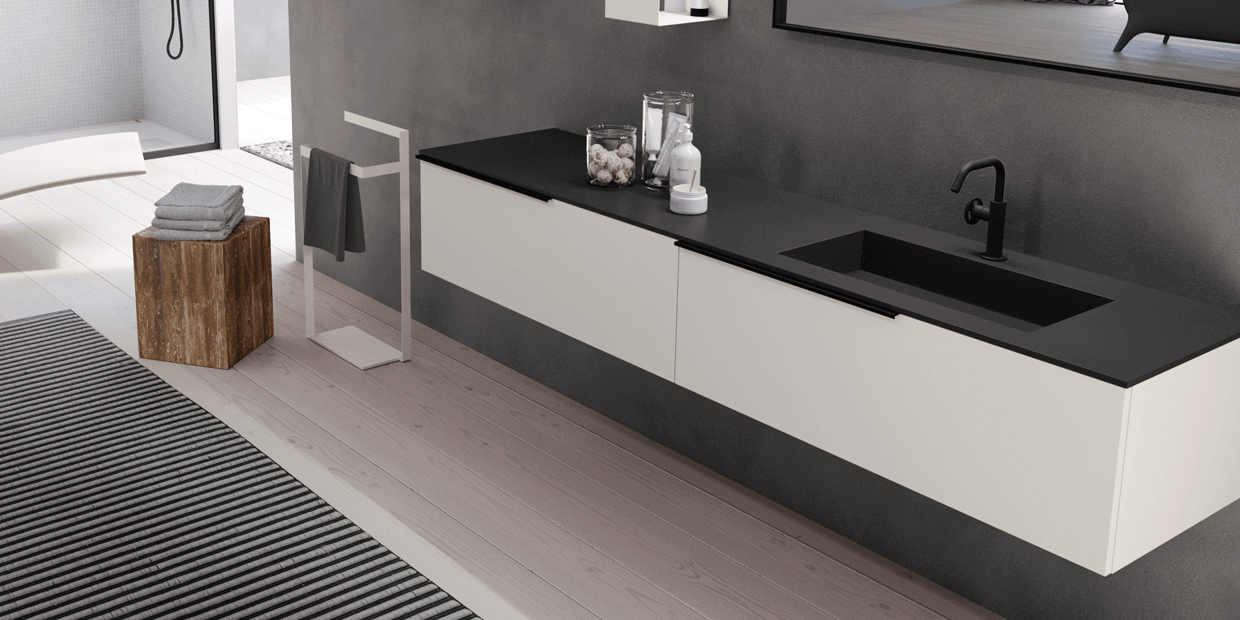 A black Fenix countertop paired with a white cabinet