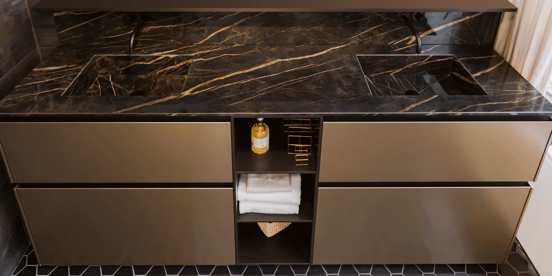 Dark brown porcelain countertop with gold veining and two integrated basins