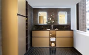 Black and gold bathroom with porcelain countertop
