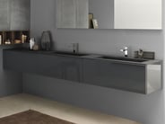 Dark porcelain countertop with two integrated vessels on a coordinated grey wall-mounted vanity