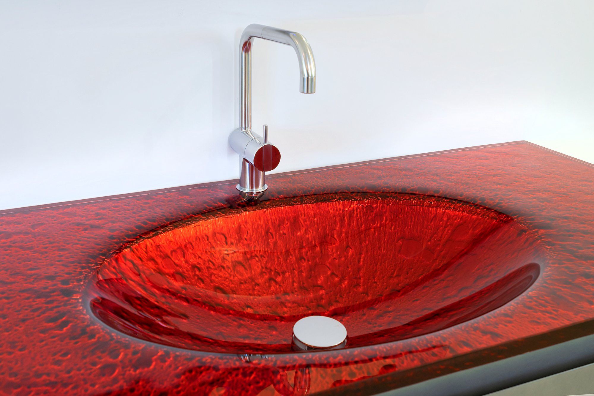 Fire-red Vetro glass countertop with an integrated glass sink
