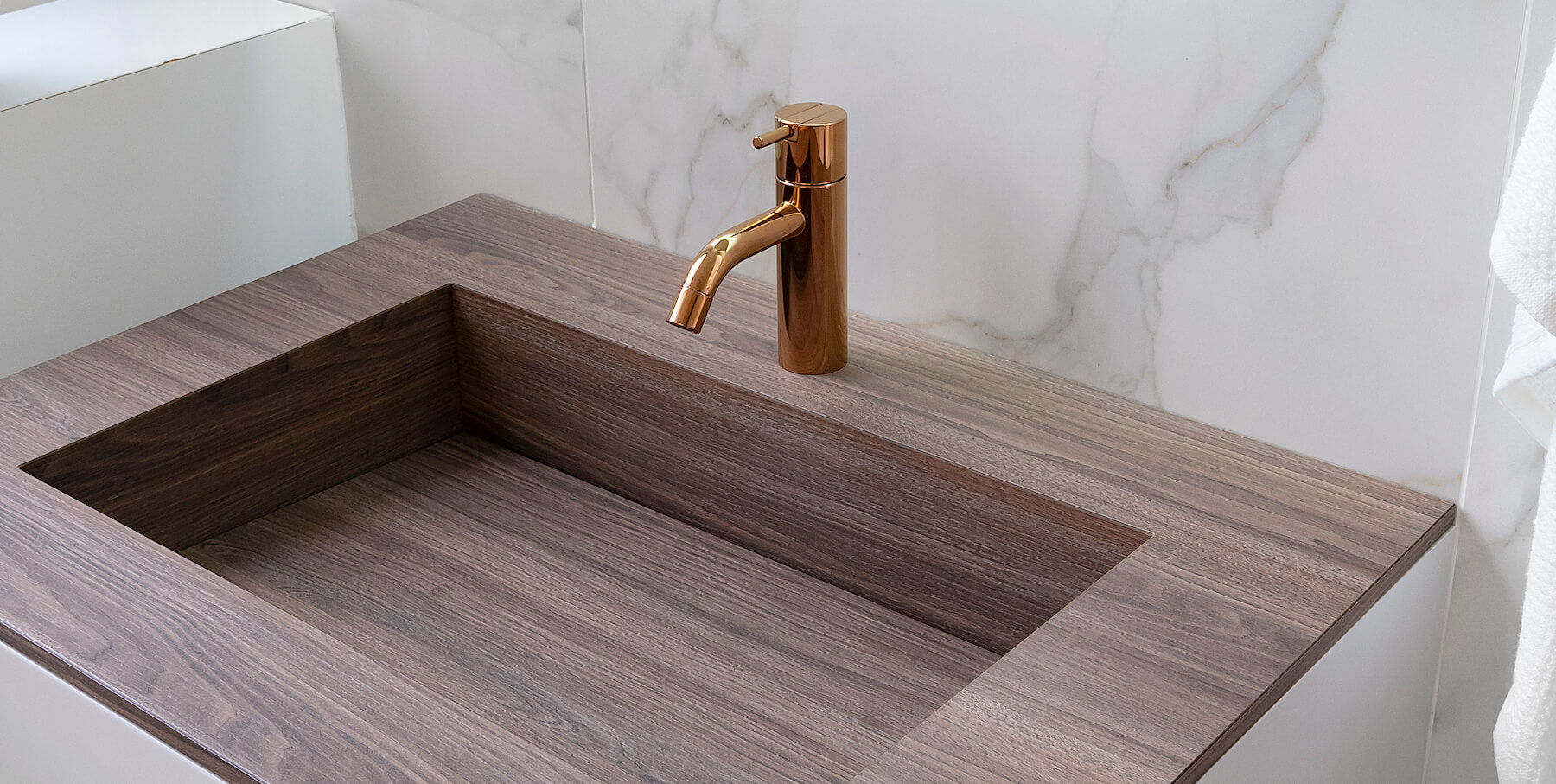 Bronze deck-mounted VOLA faucet above a basin
