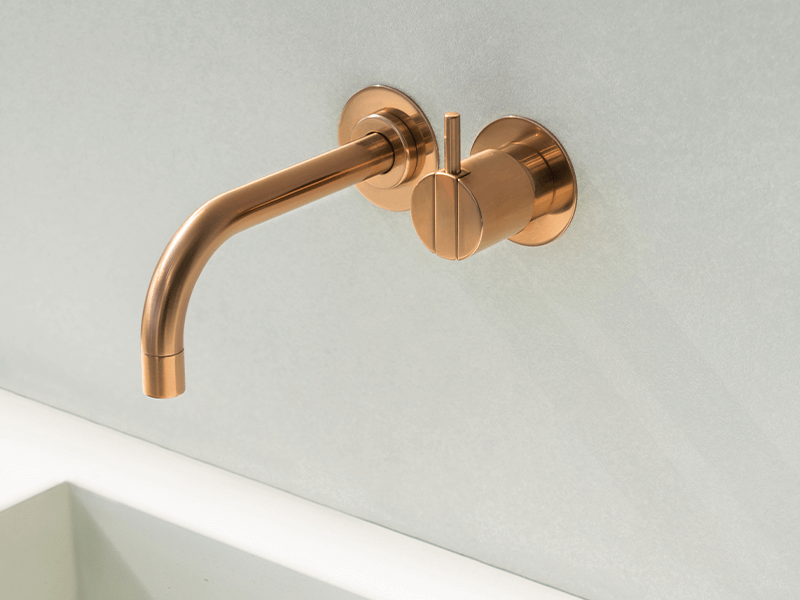 Gold wall-mount VOLA faucet and mixer