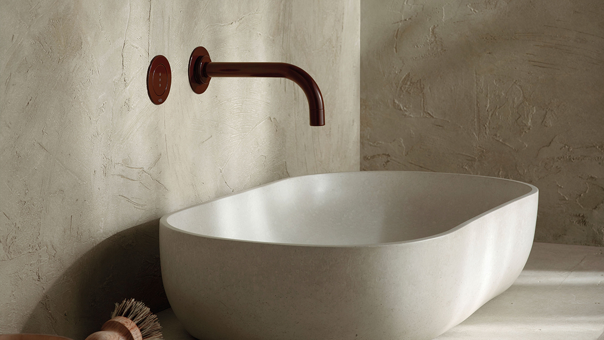 Luxury VOLA Wall-mont faucet above white vessel