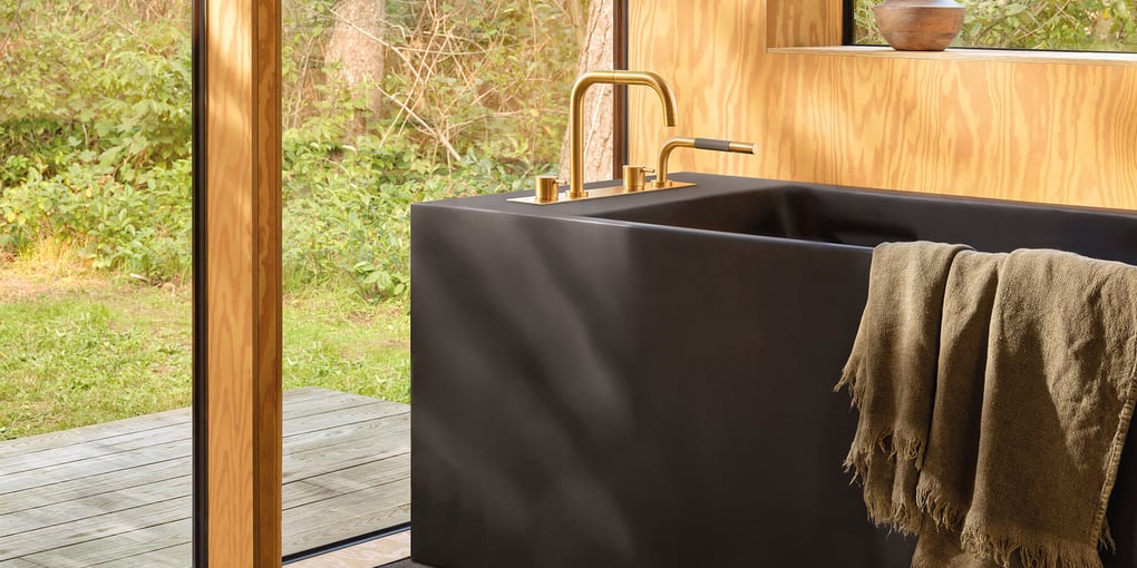 A deck-mounted VOLA tub filler