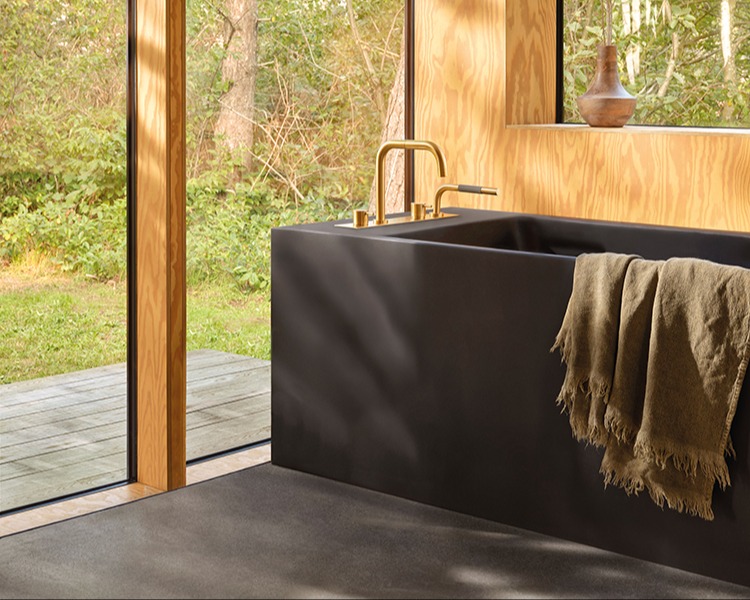 gold VOLA deck-mounted tub filler