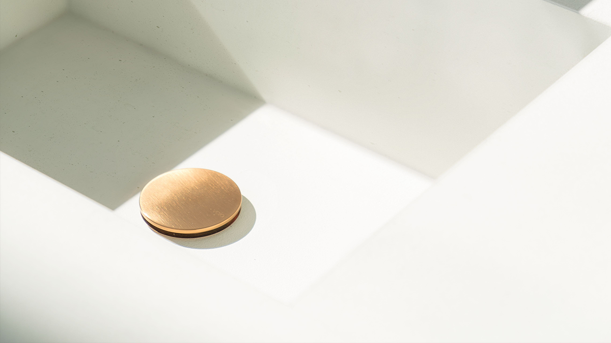 gold VOLA push-to-close basin drain