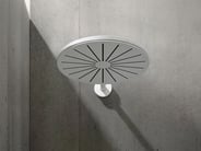 A white VOLA shower head