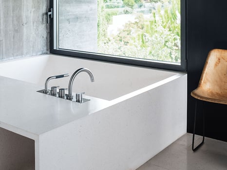 Deck-mounted tub filler and hand shower
