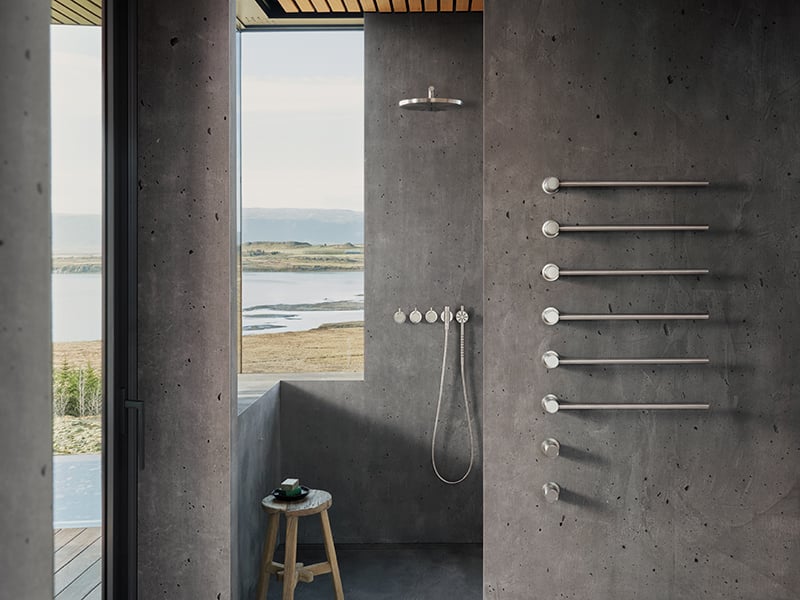 VOLA towel warmer next to shower