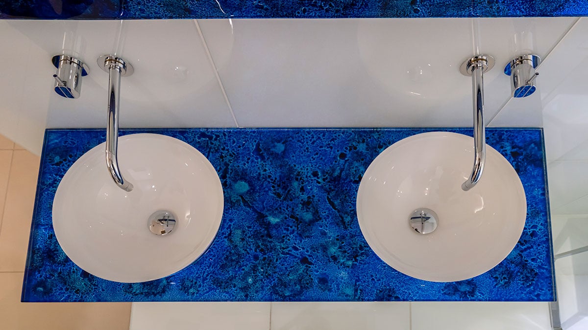 Ocean blue Vetro glass countertop in a luxury bathroom