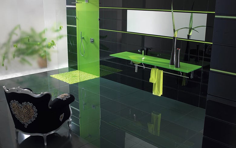 Lime green Vetro glass countertop in a black-tiled bathroom