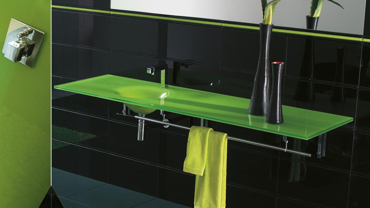 A lime green Vetro glass countertop in a luxury bathroom