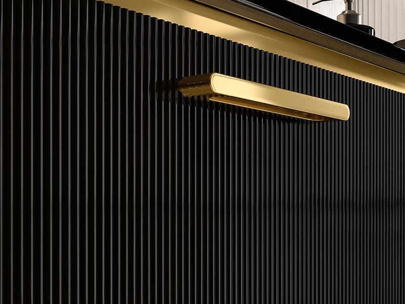 Gold handle on black drawer
