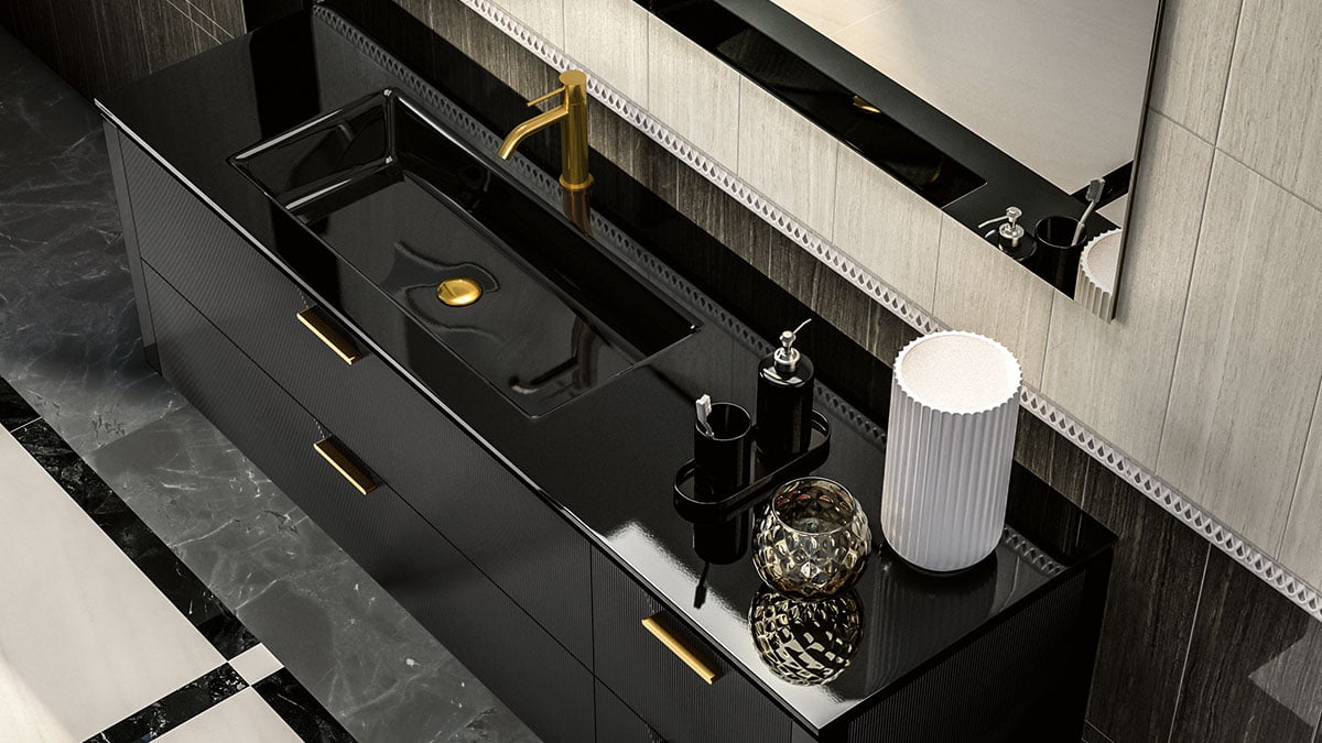 Gold faucet and drawer details on black cabinets