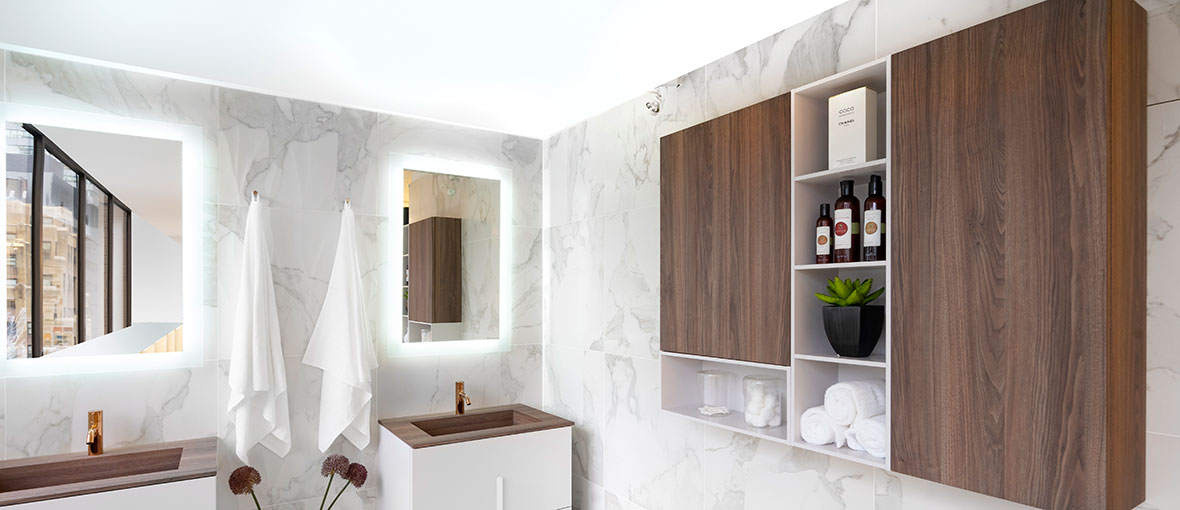 Cubes in wood finish with white details on top of a marble wall