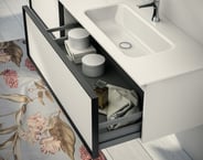 Class vanity with open drawer