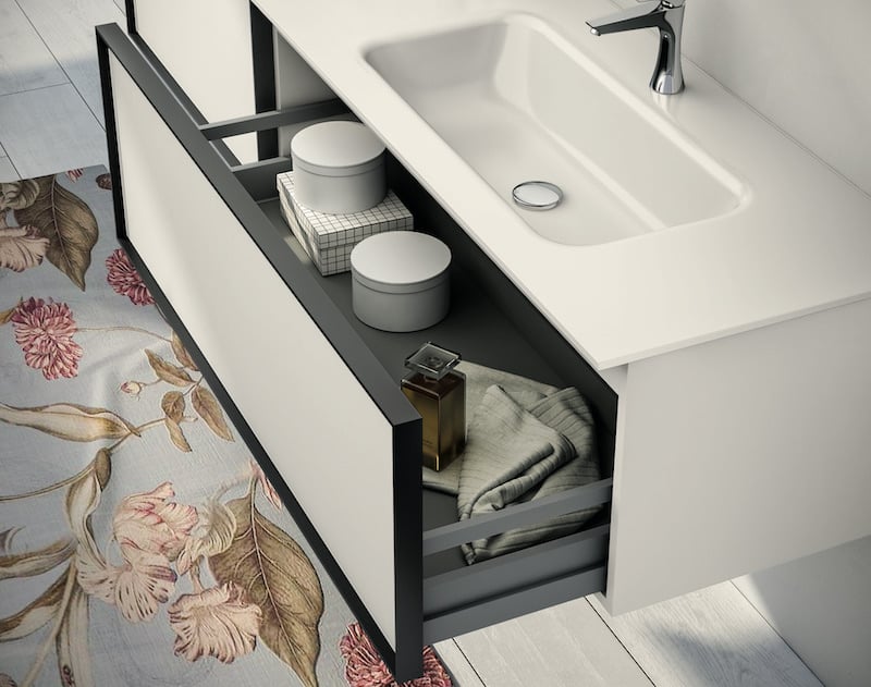 Class vanity with open drawer