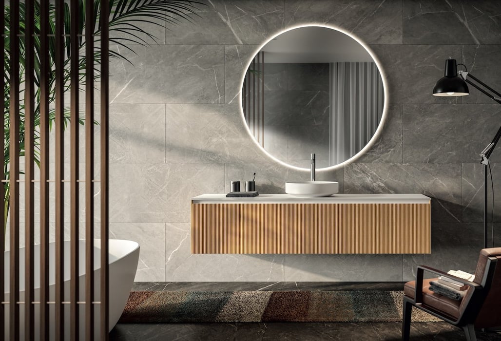 light wood bathroom vanity with round mirror