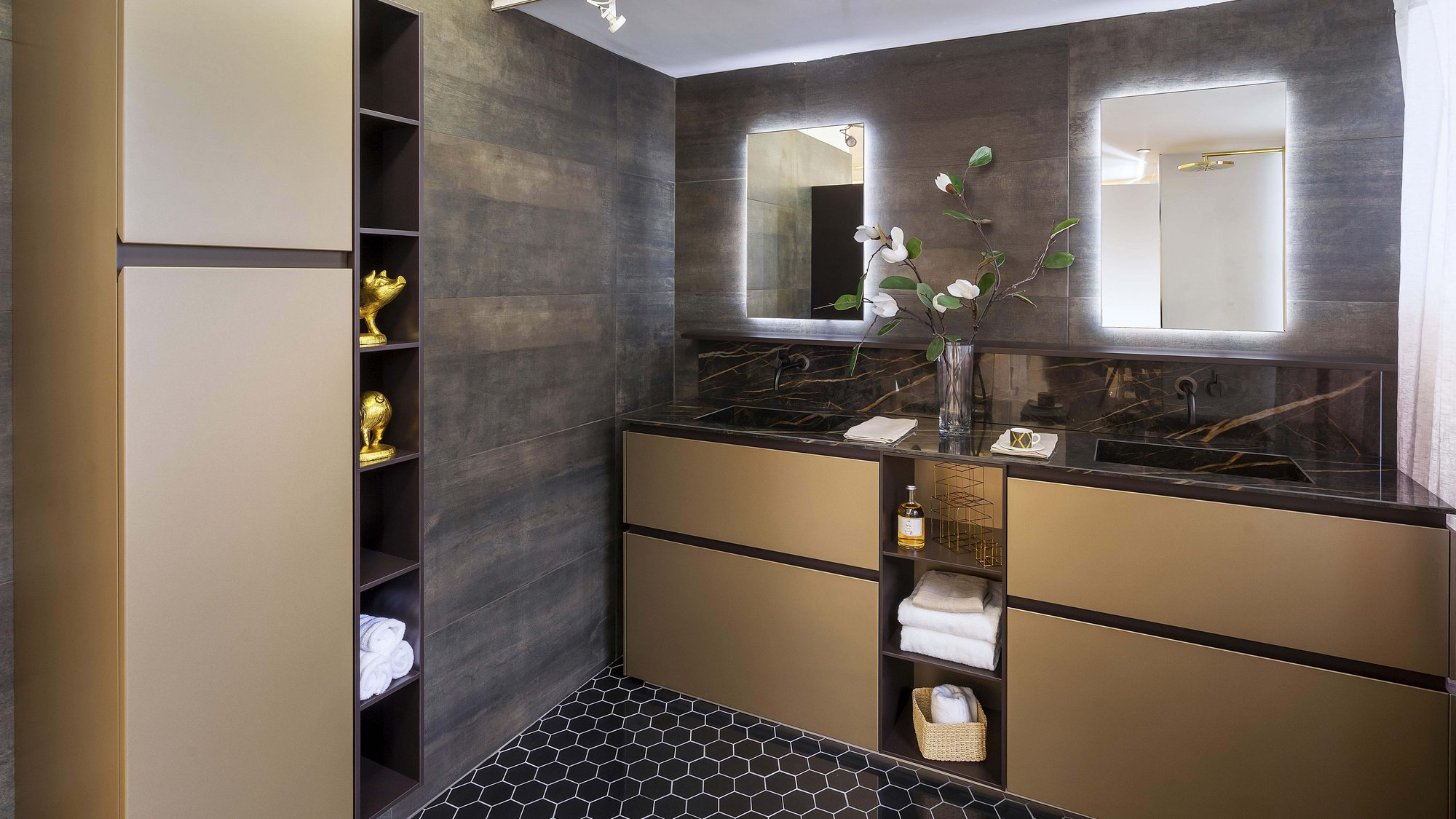 A bathroom with golden color floor mounted vanities with brown edges