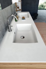 double basin white solid-surface bathroom countertop