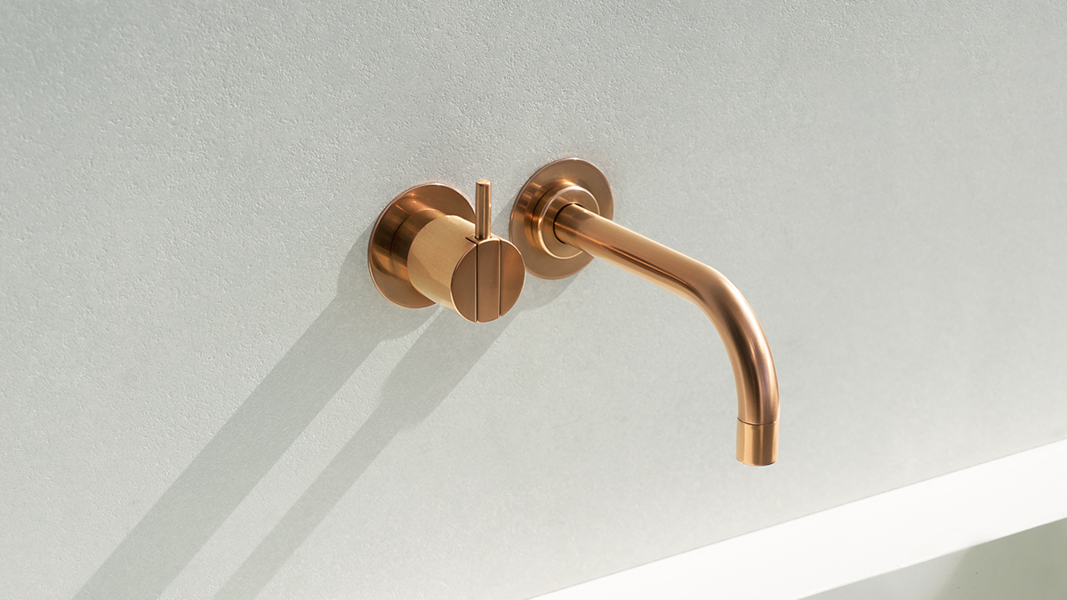 VOLA gold wall-mount bathroom faucet