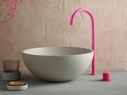 Hot pink VOLA faucet with neutral vessel sink