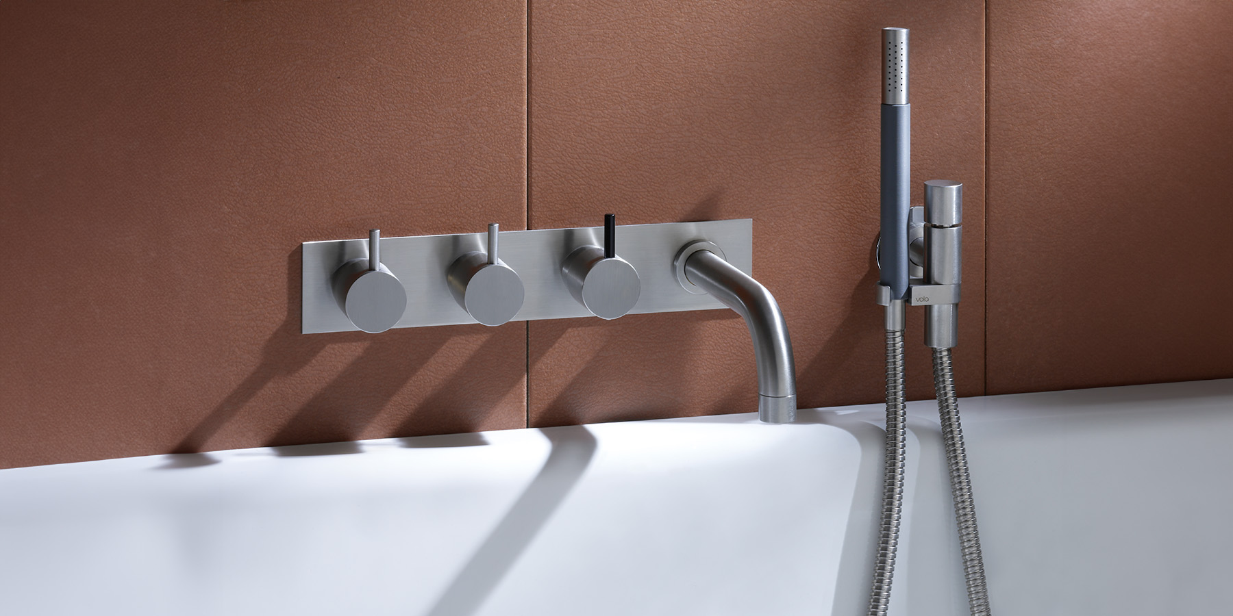 wall-mounted VOLA tub filler with hand shower