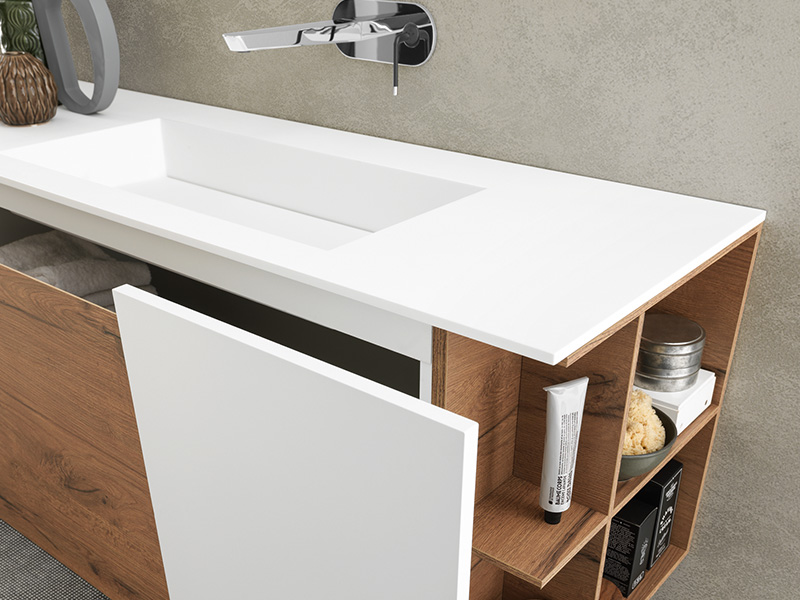 Wood-look bathroom vanity with white countertop and open side shelving