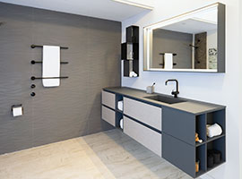 Blue bathroom vanity with open side shelf and grey cabinet fronts